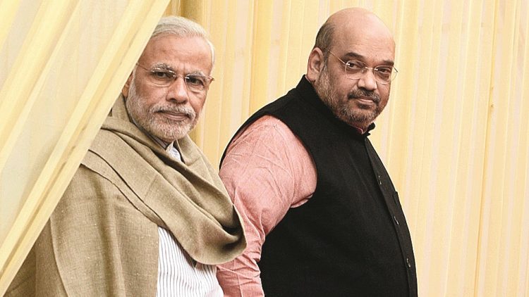 Prime Minister Narendra Modi and Amit Shah during the Diwali Mangal Milan at party headquarters in New Delhi on Saturday. Picture by Rajesh Kumar.28/November/2015