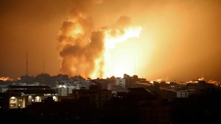 Fire and smoke rises above buildings during an Israeli air strike in Gaza City on October 8, 2023. At least 200 Israelis died in a surprise large-scale attack by the Palestinian militant group Hamas on October 7, 2023, the army said, as Prime Minister Benjamin Netanyahu vowed to reduce the group's Gaza hideouts to "rubble". (Photo by EYAD BABA / AFP) (Photo by EYAD BABA/AFP via Getty Images)